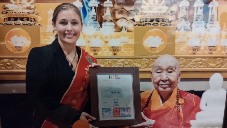 Accepting Dharma Support Association award from Venerable Grand Master Wei Chueh